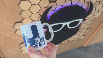 Tulsa skyline coffee mug with navy design and bold “TULSA” text
