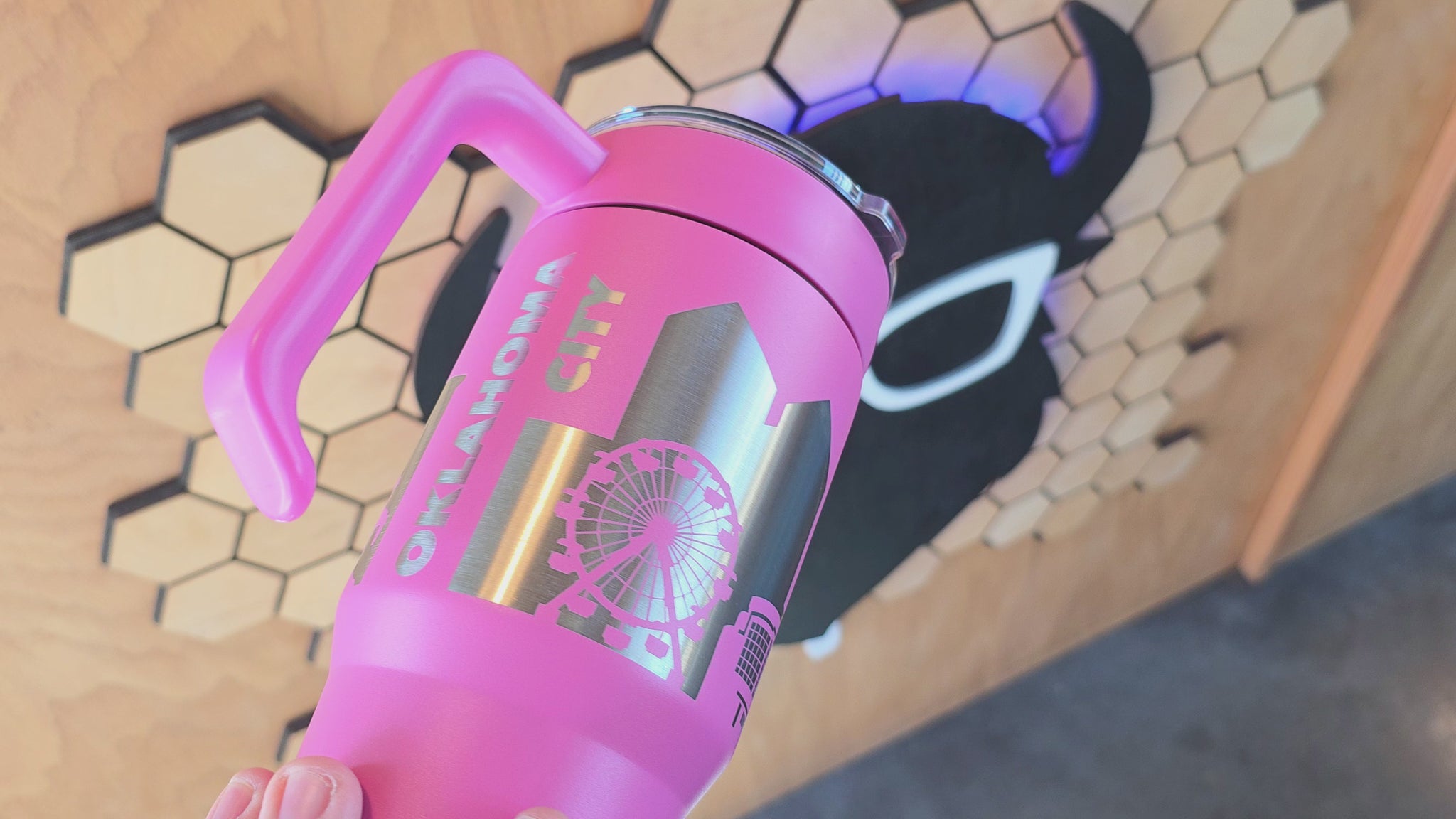 video showing Pink Oklahoma City Skyline 30oz tumbler with handle and laser-engraved stainless design, stylish OKC souvenir by The Curious Bison.