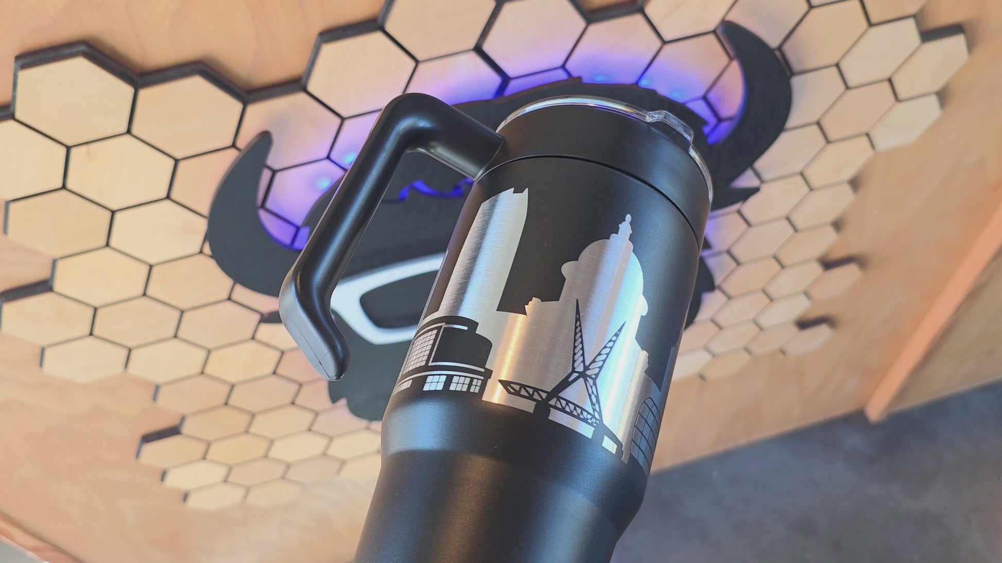 video showing Black Oklahoma City Skyline 30oz handle tumbler with engraved stainless design, handcrafted OKC travel mug by The Curious Bison.