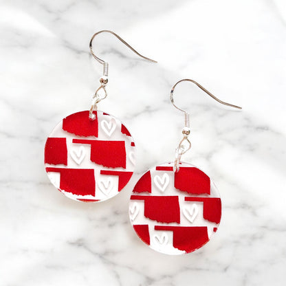 Red Oklahoma heart acrylic earrings with printed state pattern and white heart accents, lightweight hypoallergenic earrings for Oklahoma souvenir or state pride gift