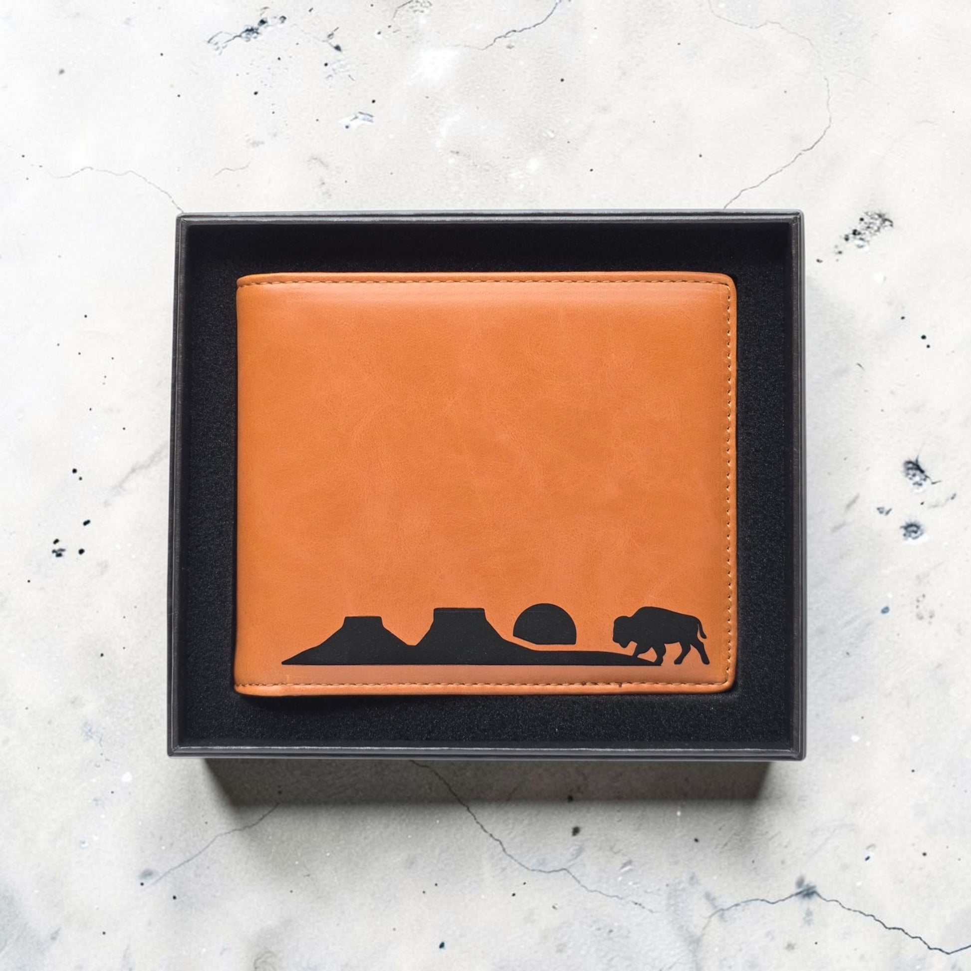 Gift boxed RFID Wallet Bison Plateau Landscape Mens Bifold with tan leatherette exterior and bold black plateau scene design, men’s bifold wallet gift idea