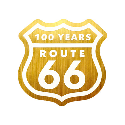 Brushed gold Route 66 centennial vinyl sticker with classic highway shield design celebrating 100 years of Route 66, retro Americana travel decal for souvenir collectors and road trip travelers