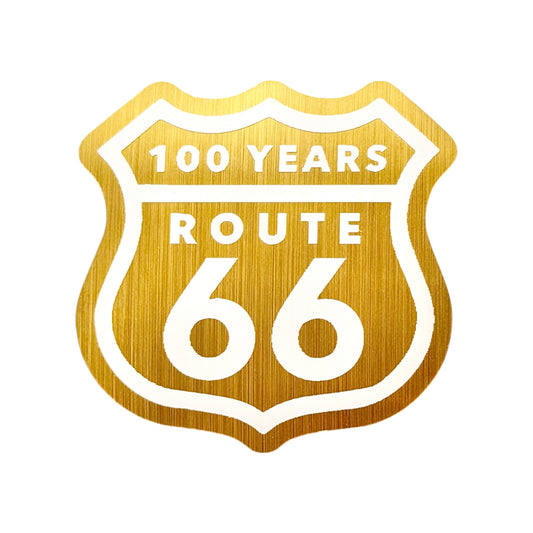 Brushed gold Route 66 centennial vinyl sticker with classic highway shield design celebrating 100 years of Route 66, retro Americana travel decal for souvenir collectors and road trip travelers