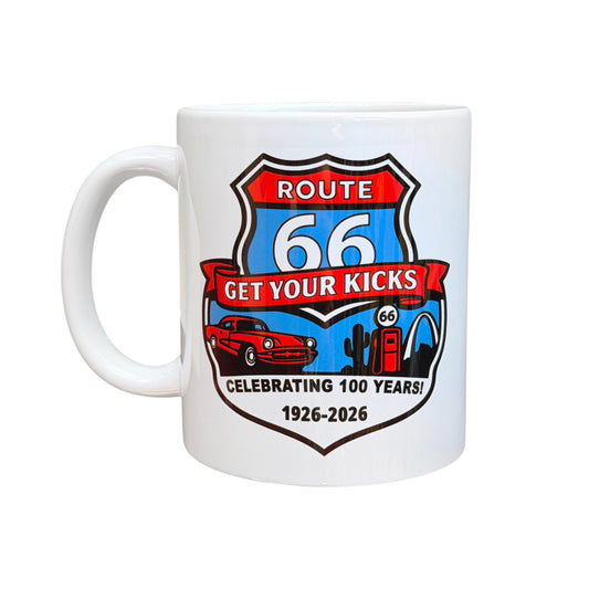 White ceramic Route 66 Centennial coffee mug featuring colorful Get Your Kicks shield artwork with vintage car, gas pump, cactus, and retro Americana travel design celebrating 100 years of Route 66 from 1926 to 2026