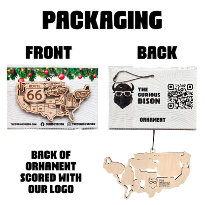 Route 66 USA map wooden ornament displayed in retail packaging showing front and back of ornament with Curious Bison logo and QR code, packaged travel souvenir ornament for Route 66 gift shops.