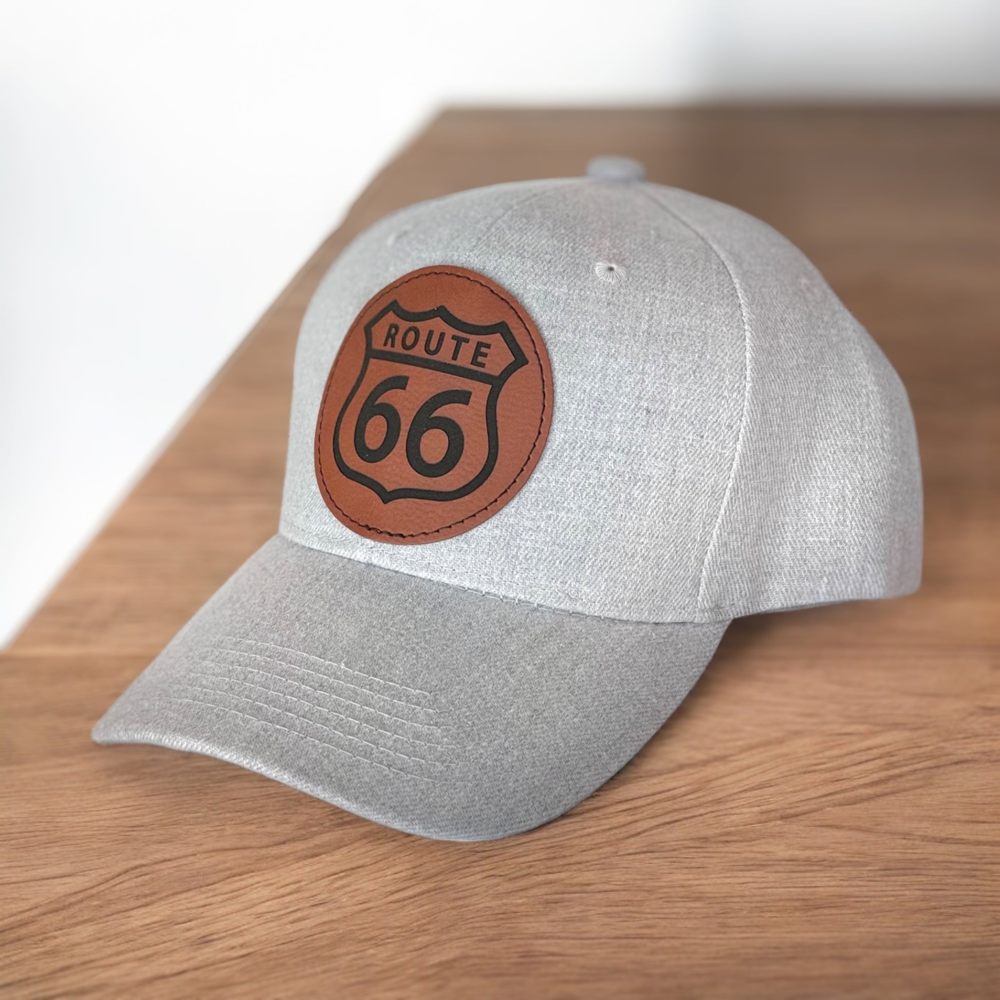 Side view of gray Route 66 trucker hat and adjustable closure, Oklahoma Route 66 souvenir hat