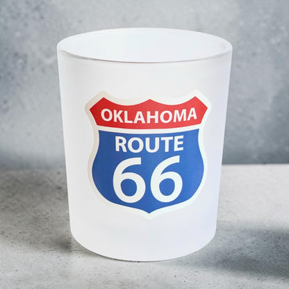 Oklahoma Route 66 frosted whiskey glass photographed against a gray studio background, showing the full-color highway shield UV printed on the front of the 8 oz lowball glass
