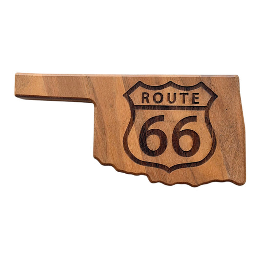 Front view of Oklahoma shaped walnut bottle opener with dark laser engraved Route 66 highway shield, natural wood grain, and state outline for an Oklahoma travel souvenir