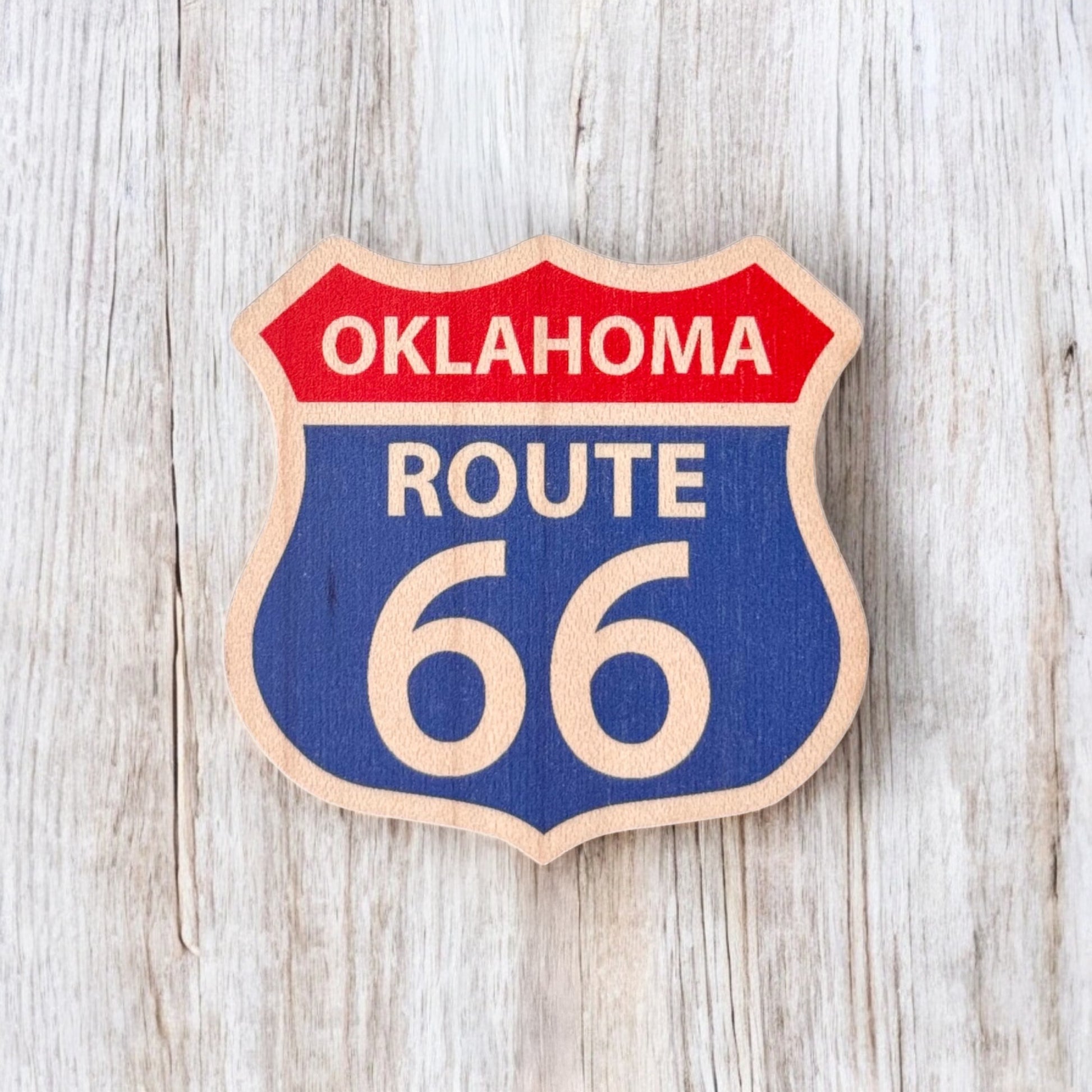 Route 66 Oklahoma wooden magnet displayed on a light wood background, classic Route 66 shield magnet designed as an Oklahoma travel souvenir