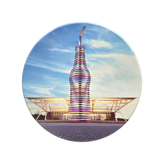 Round ceramic Route 66 Pops coaster showing the colorful giant soda bottle landmark in Oklahoma with blue sky background, travel souvenir drink coaster for road trip fans