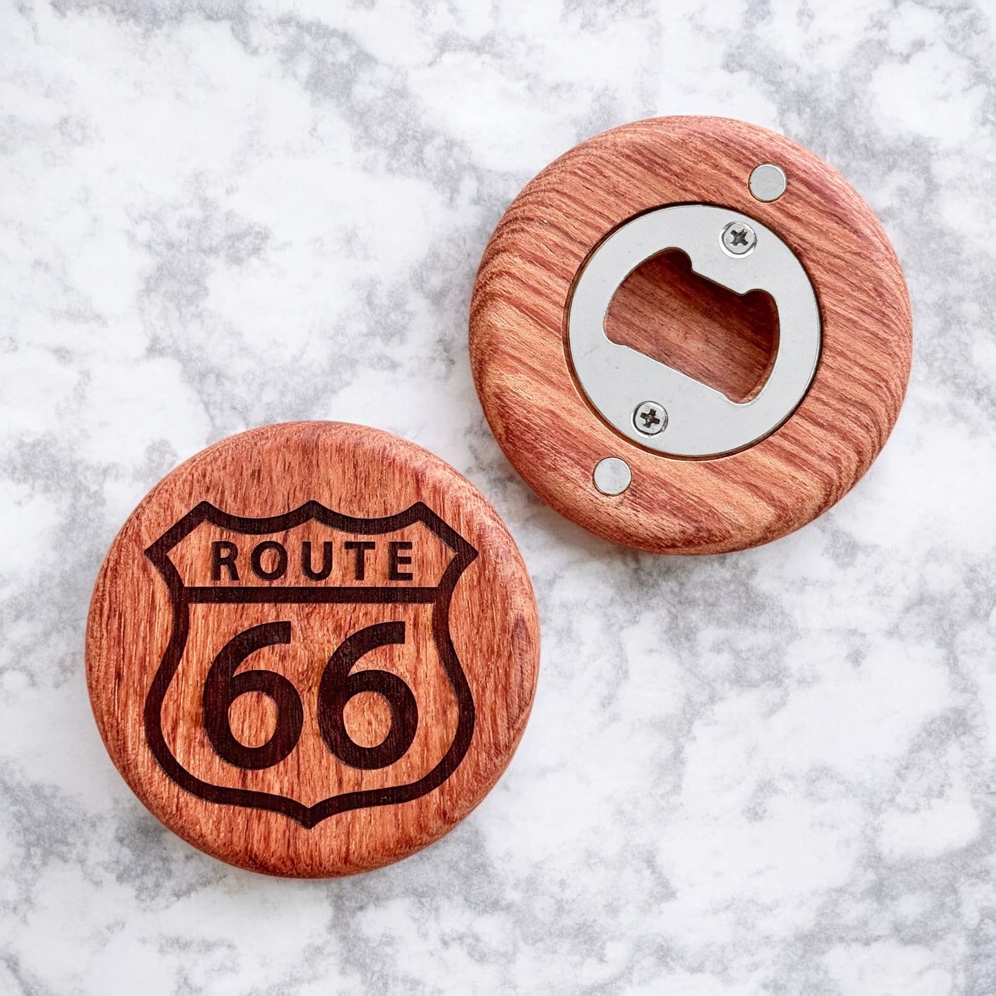 Back of Route 66 red beech wood magnet bottle opener showing metal opener insert and strong magnets, handheld wooden bottle opener