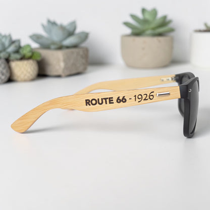 Stylish black sunglasses with natural bamboo wood arms engraved with Route 66 text, unique gift idea for road trippers and Route 66 collectors