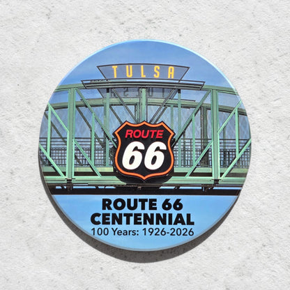 Route 66 Tulsa bridge sign ceramic coaster shown against textured wall, colorful Tulsa souvenir coaster with iconic Oklahoma Route 66 artwork
