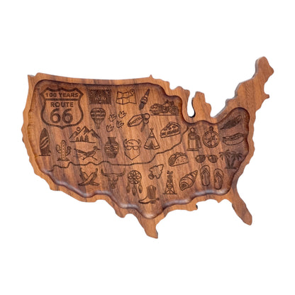 USA shaped wooden catch all tray engraved with Route 66 shield and Americana travel icons including classic car, cowboy boot, cactus, surfboard, motel key, taco, and vintage road trip artwork for travel lovers and souvenir collectors