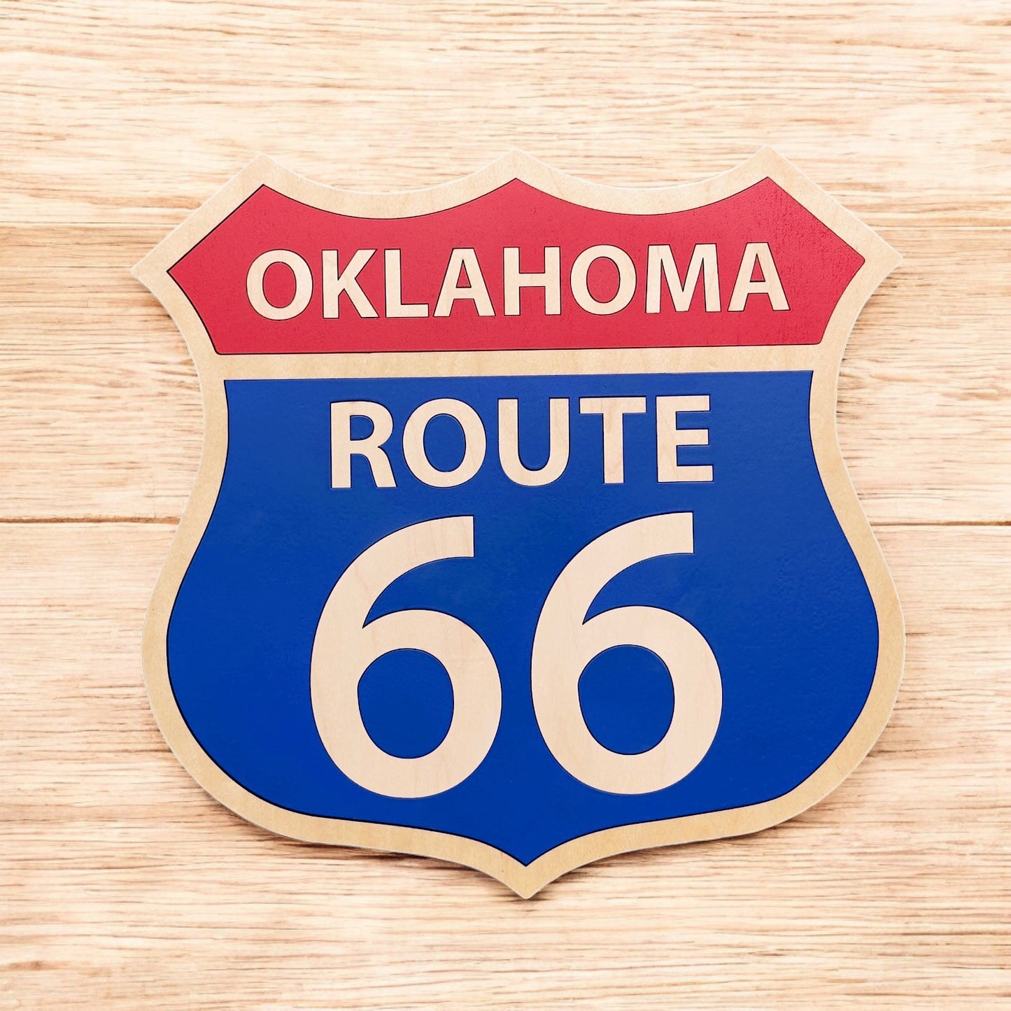 Route 66 wooden wall decor sign displayed on wood surface, classic highway shield shape layered wood sign for Route 66 souvenir or travel gift