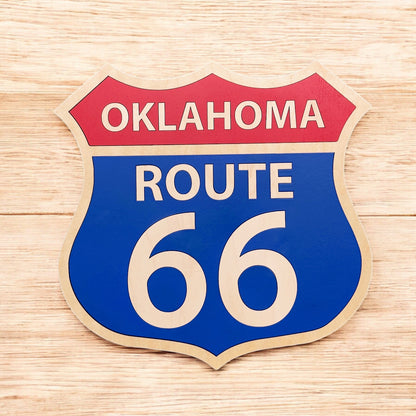 Route 66 wooden wall decor sign displayed on wood surface, classic highway shield shape layered wood sign for Route 66 souvenir or travel gift