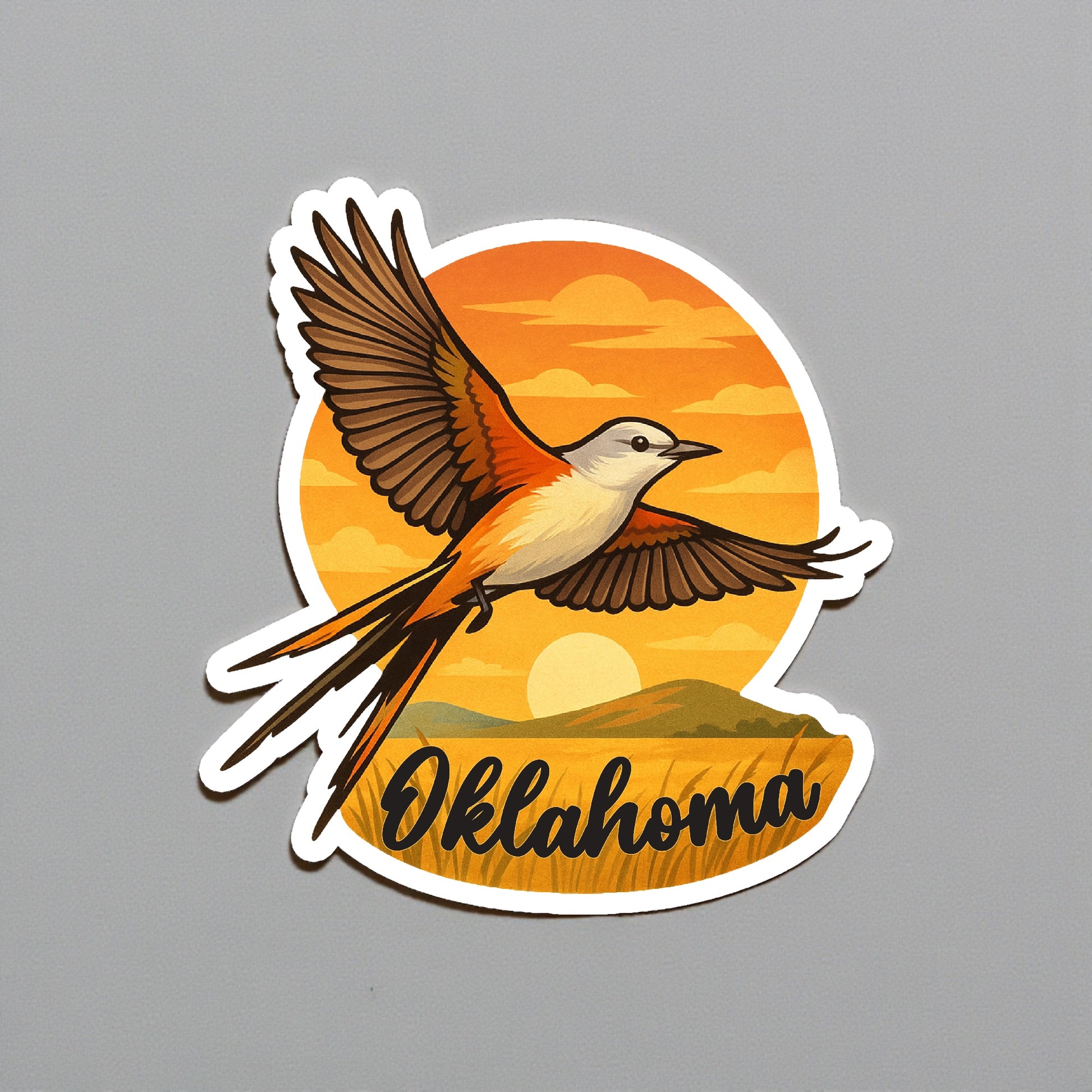 Die cut Oklahoma scissortail flycatcher sunset sticker displayed on a neutral wall surface, detailed state bird artwork with prairie sunset background and Oklahoma lettering for travel souvenir use