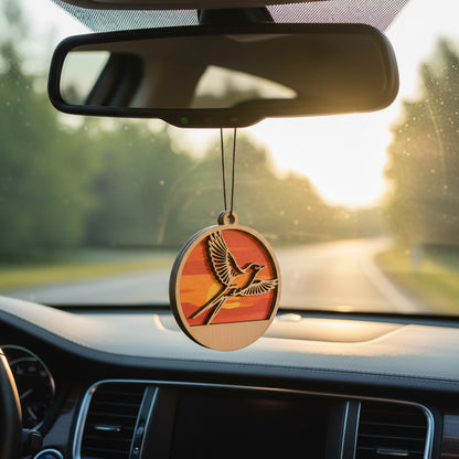 Round wooden scissortail flycatcher sunset car ornament hanging from rearview mirror, layered bird silhouette with warm orange and red sunset background, lightweight auto accessory gift for Oklahoma locals, bird lovers, and Route 66 road trip souvenir collectors