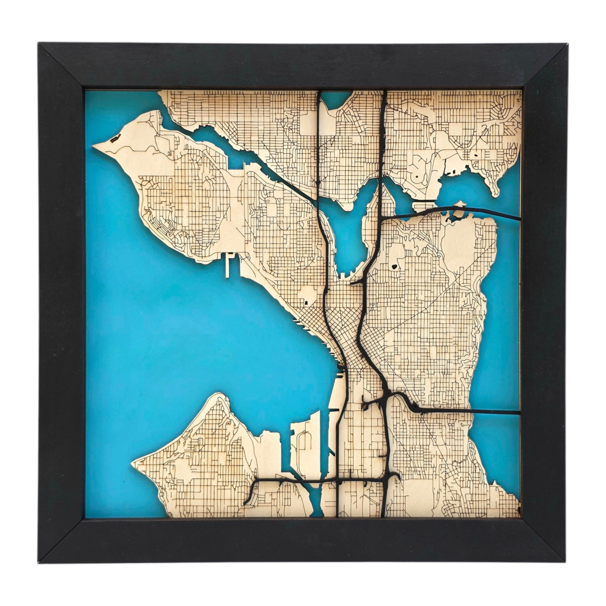 Seattle wooden city map wall art without city name showing layered wood streets and blue water background, modern Seattle decor piece for home or office