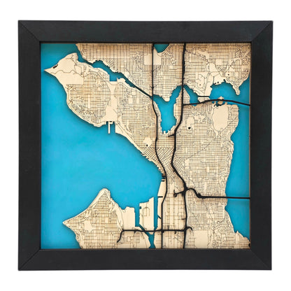 Seattle wooden city map wall art without city name showing layered wood streets and blue water background, modern Seattle decor piece for home or office
