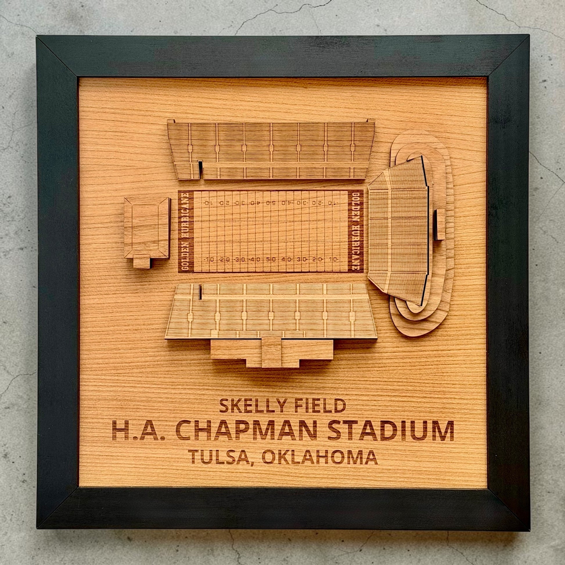 Front facing framed wood stadium map of Skelly Field at H.A. Chapman Stadium in Tulsa Oklahoma with engraved lettering and layered architectural wood construction