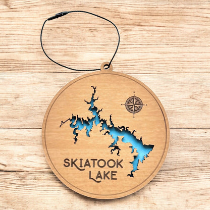 Skiatook Lake wooden ornament hanging by black cord, two layer wood lake map ornament with blue painted water detail
