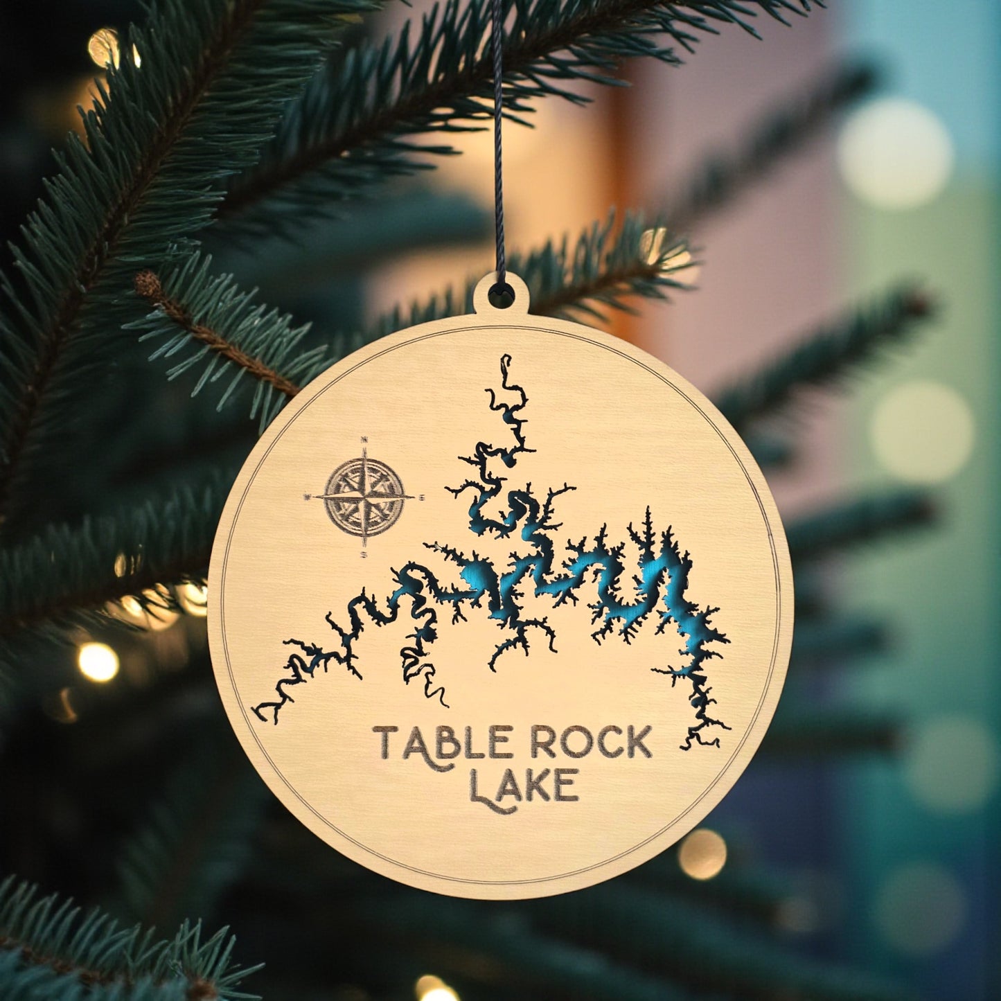 Table Rock Lake ornament hanging on Christmas tree with lights, wooden lake map decoration by The Curious Bison.