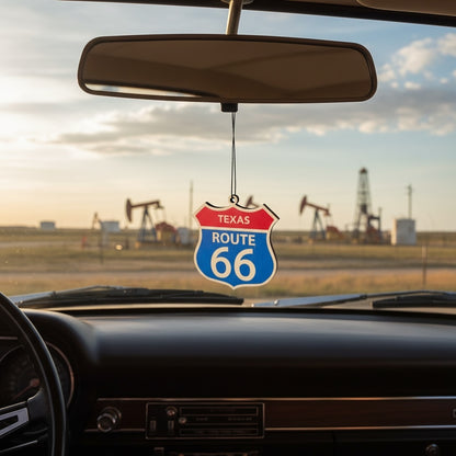 Texas Route 66 shield wood ornament hanging from a car rearview mirror with Texas oil field landscape in background, Americana road trip decor inspired by historic Route 66 travel