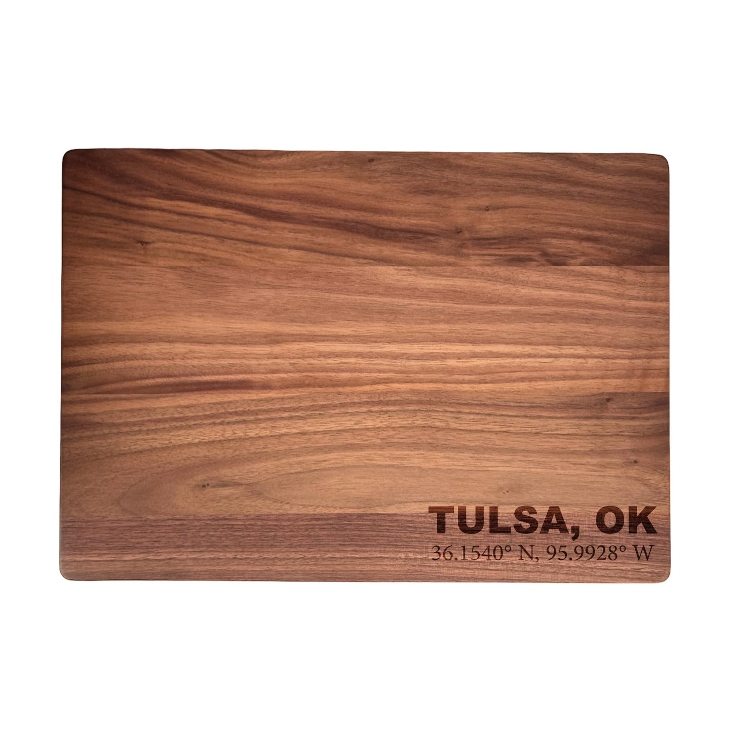 Walnut cutting board engraved with Tulsa Oklahoma coordinates, solid wood board with rich grain and clean rectangular shape