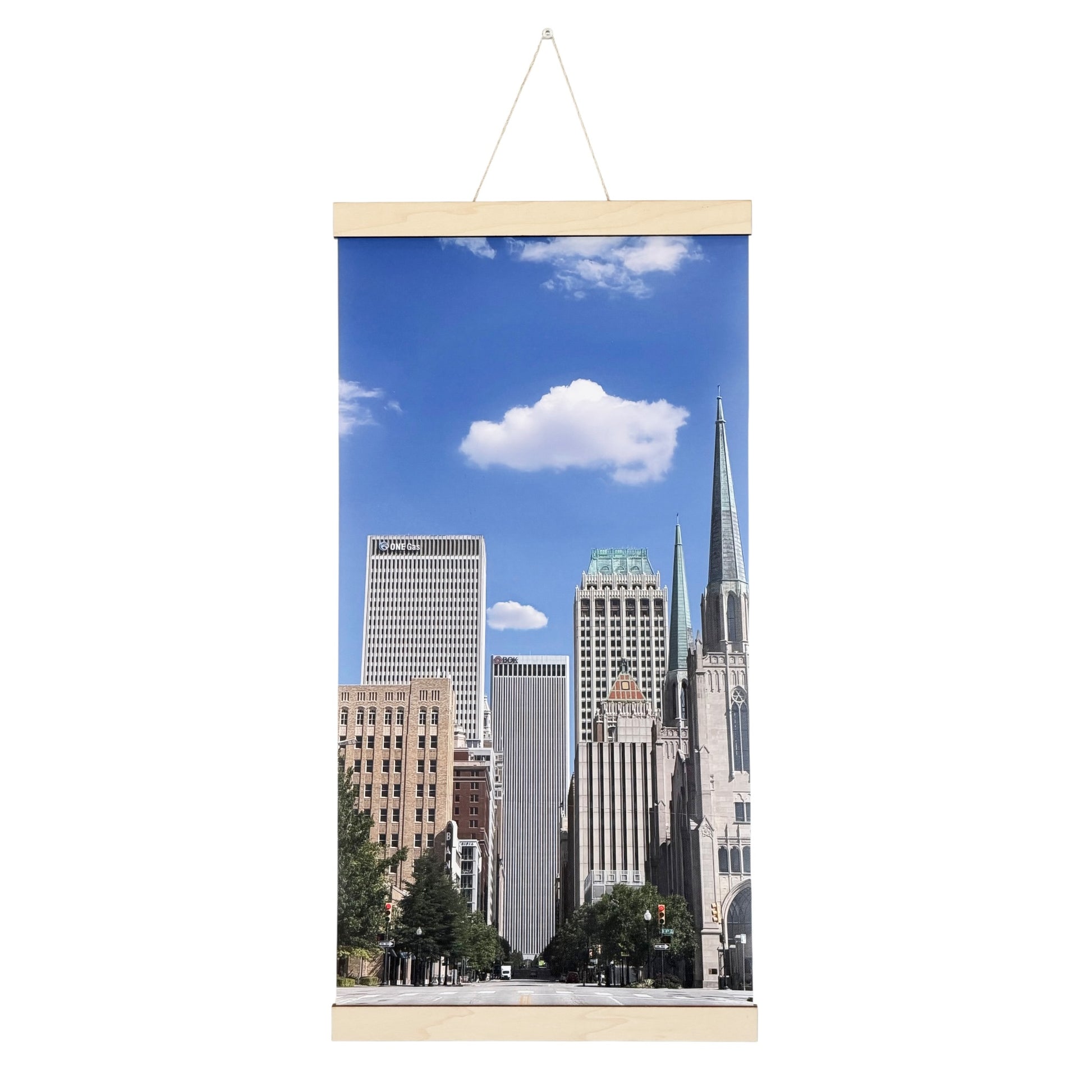 Tulsa downtown canvas wall hanging featuring original photography looking north along Boston Avenue with downtown buildings, church spires, blue Oklahoma sky, and natural wood hanging rails