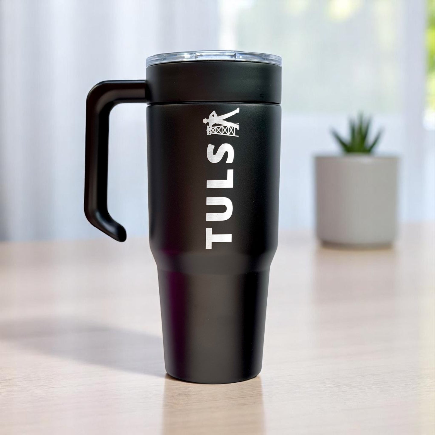 Black Tulsa Driller 30oz insulated stainless steel tumbler with detachable handle and etched Tulsa graphic for Oklahoma travel or gift use
