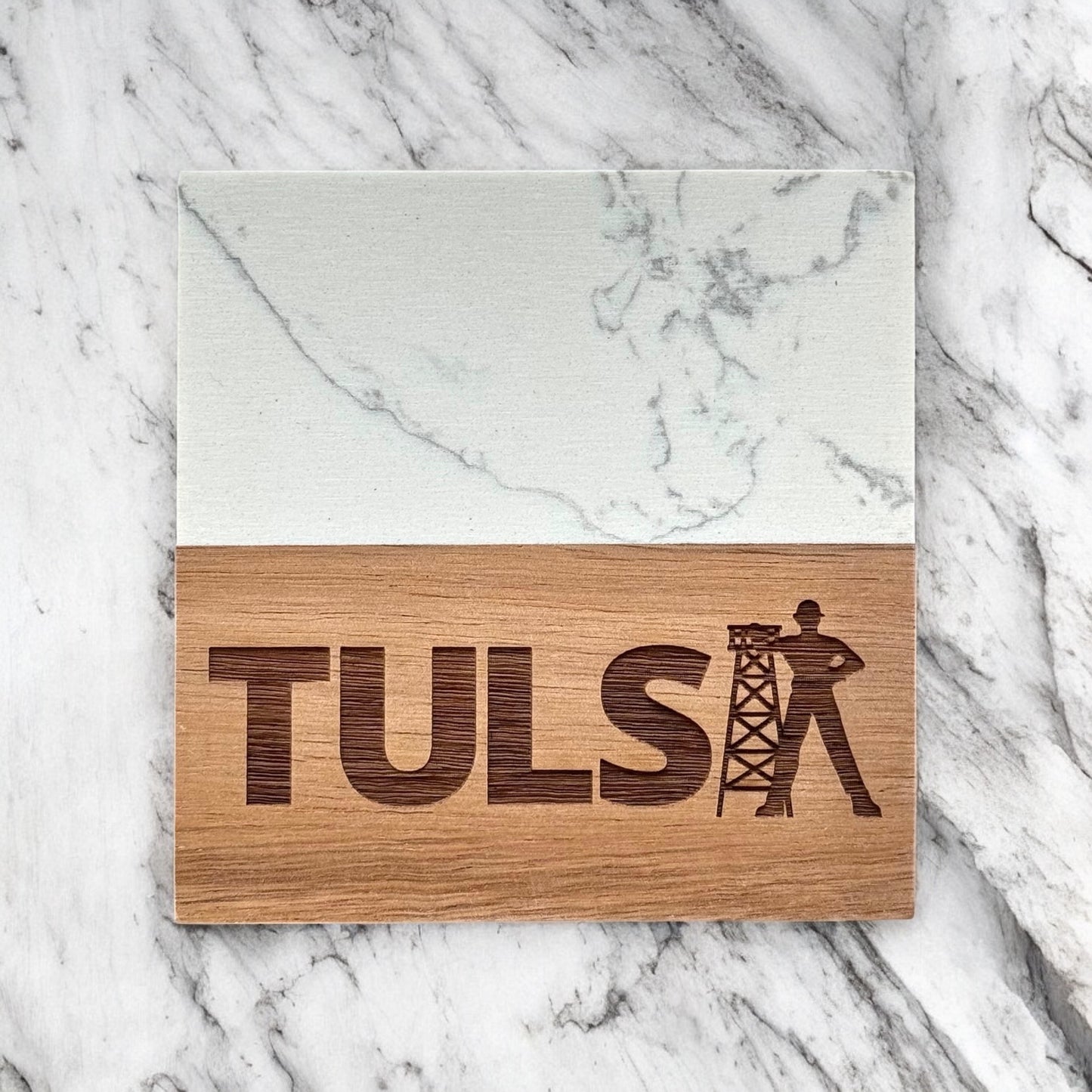 Single Tulsa Driller marble and acacia wood coaster photographed flat lay on marble surface, engraved Tulsa Driller design