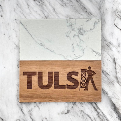 Single Tulsa Driller marble and acacia wood coaster photographed flat lay on marble surface, engraved Tulsa Driller design