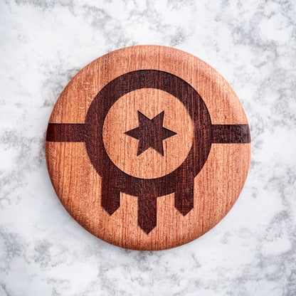 Close up of Tulsa flag laser engraving on red beech wood magnetic bottle opener with visible wood grain, Tulsa and Oklahoma souvenir item