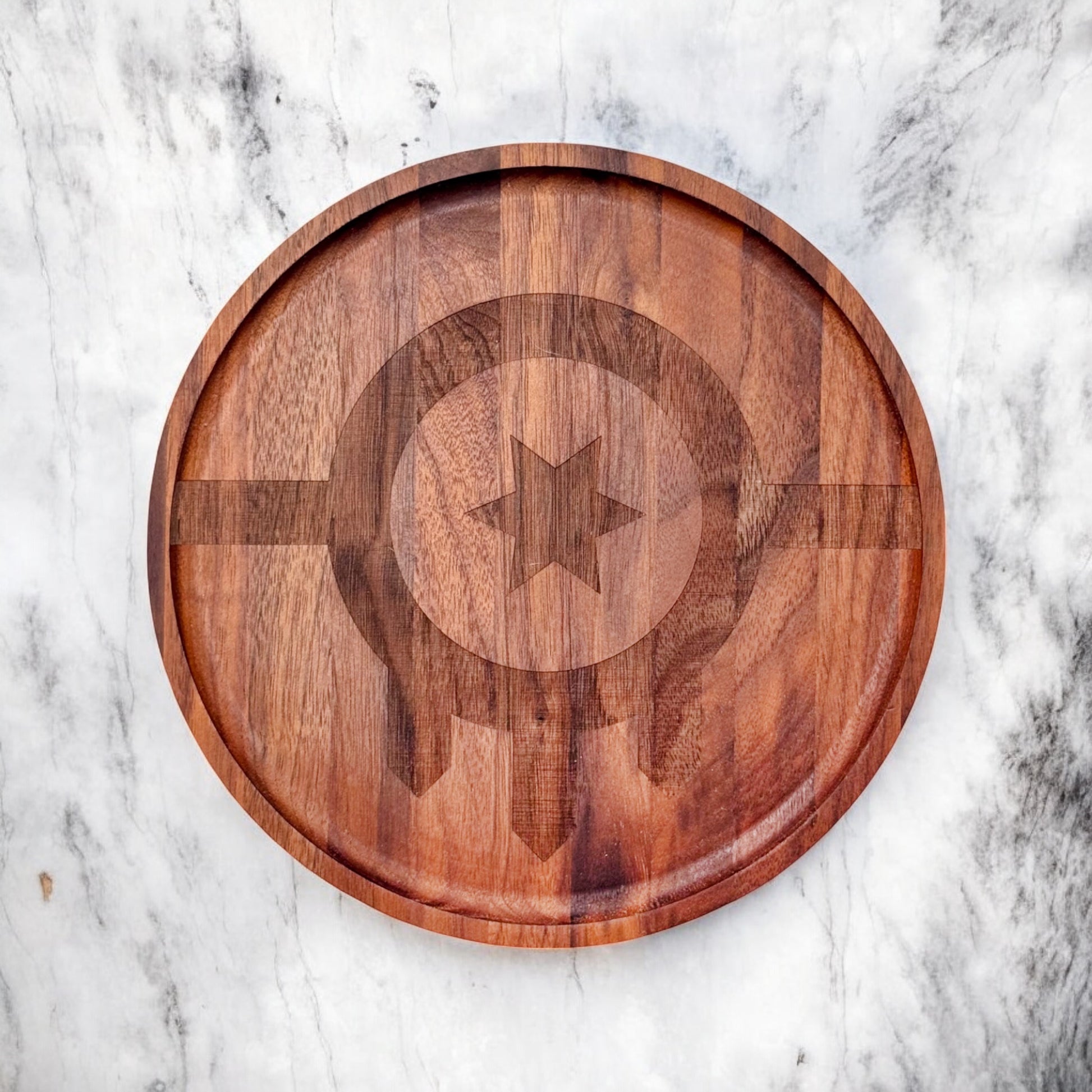 Flat lay of a Tulsa flag round walnut tray showing engraved city flag details and natural walnut grain, Oklahoma made wooden tray