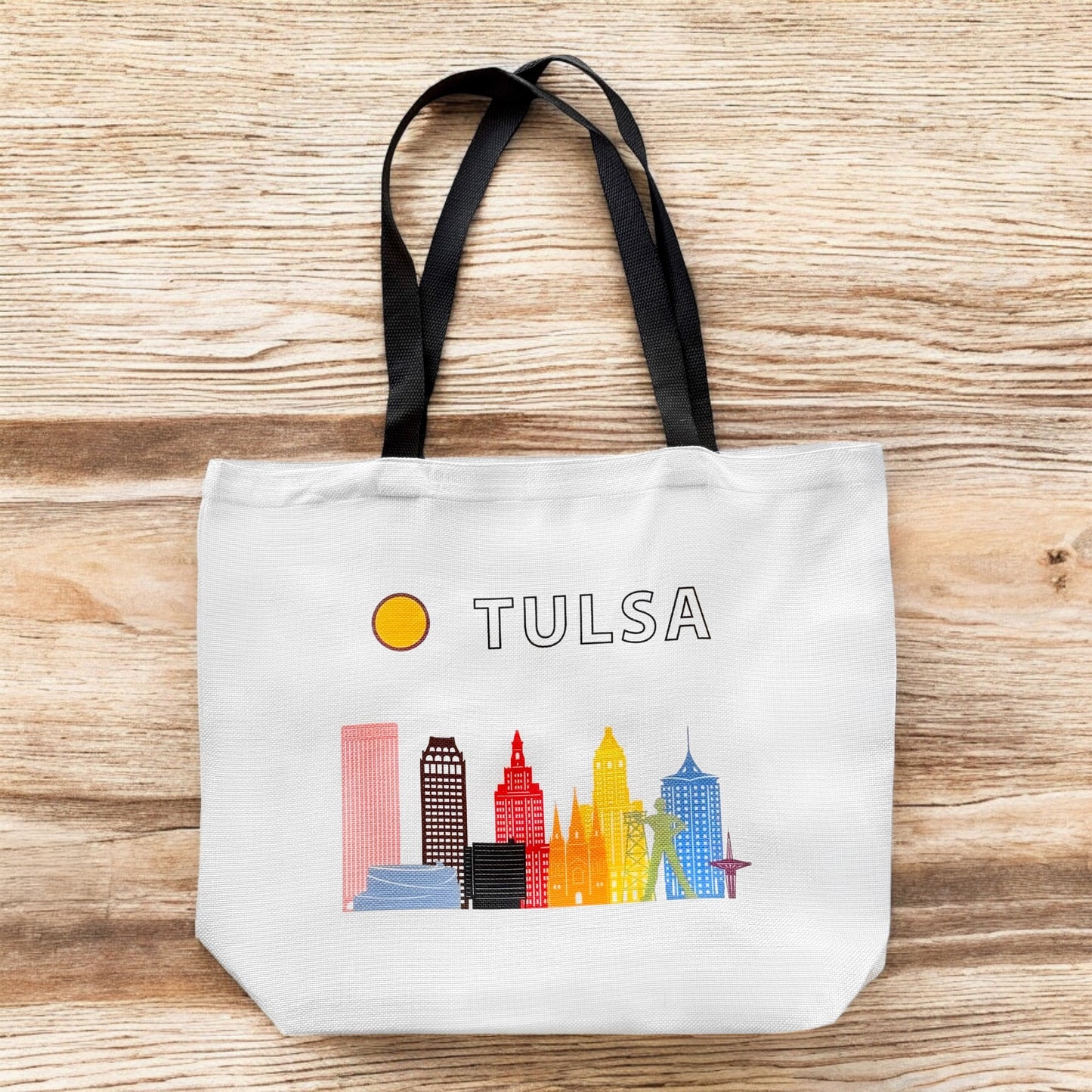 Large Tulsa Oklahoma LGBTQIA pride skyline tote bag standing upright with bright city skyline artwork