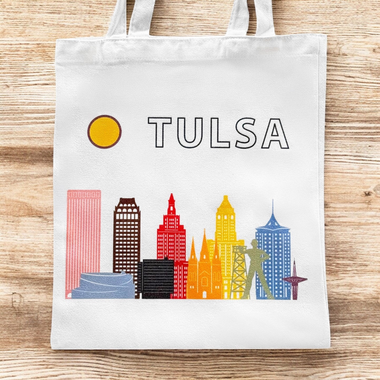 Small Tulsa LGBTQIA pride skyline tote bag shown flat with colorful Tulsa skyline design