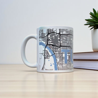 Tulsa map coffee mug on desk with books, white ceramic mug showing detailed Tulsa street grid for local pride or travel gift