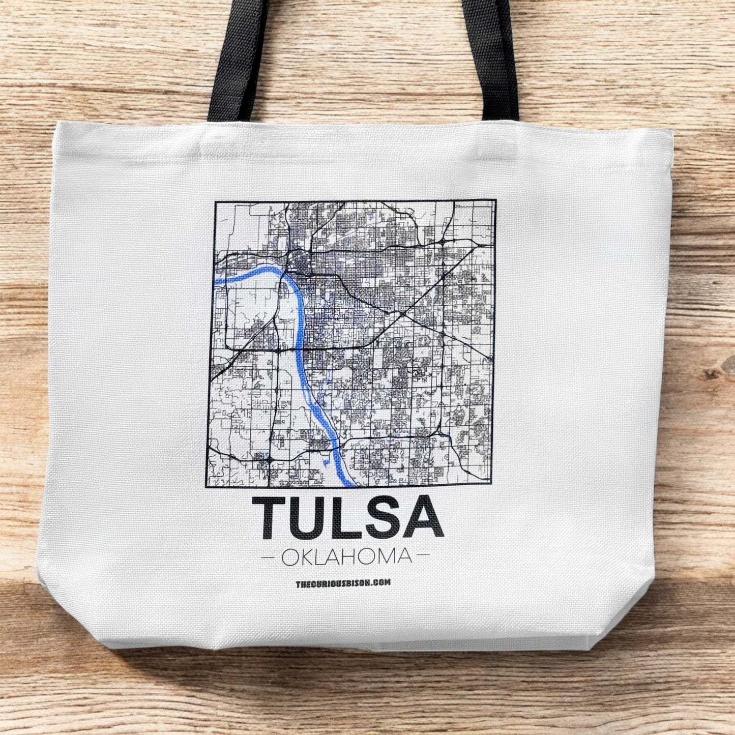 Large Tulsa map tote bag shown flat on wood surface featuring detailed Tulsa street map and bold Tulsa Oklahoma text