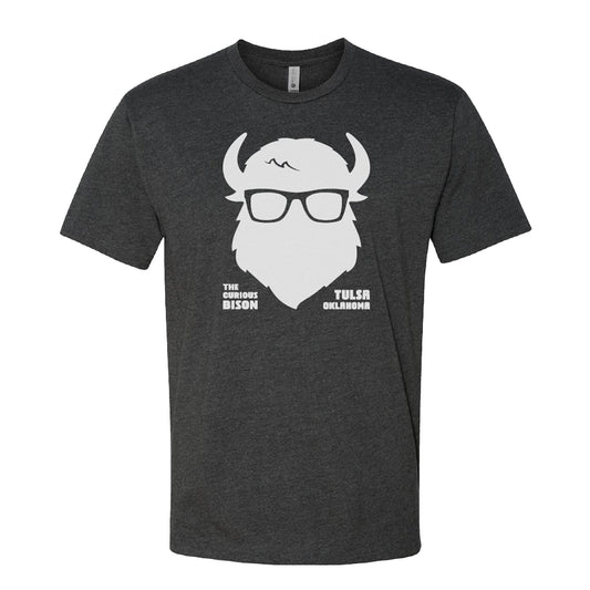 Unisex charcoal gray Tulsa Oklahoma souvenir T-shirt featuring a white hipster bison logo and “The Curious Bison – Tulsa Oklahoma” text, screen printed on a Next Level 6210 shirt.