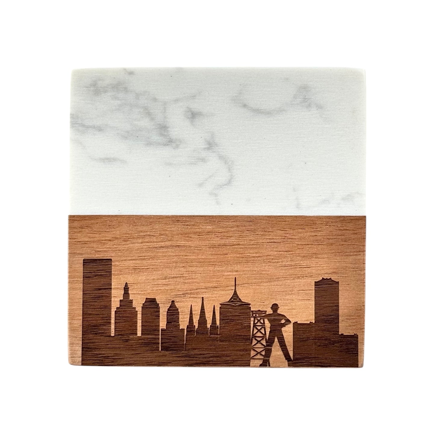 Close-up of a Tulsa Oklahoma skyline coaster made from acacia wood and marble, laser engraved with the Golden Driller and city skyline.