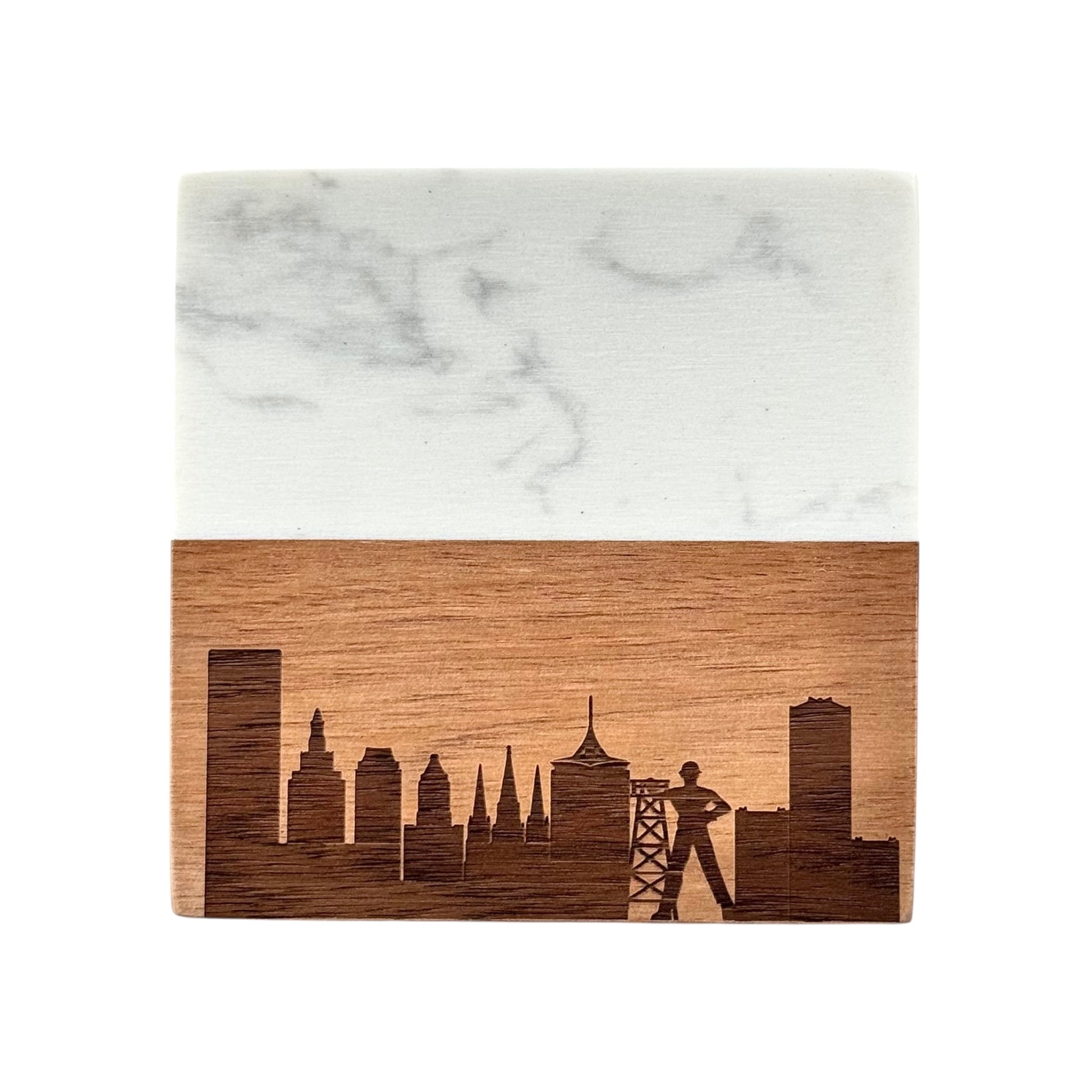 Close-up of a Tulsa Oklahoma skyline coaster made from acacia wood and marble, laser engraved with the Golden Driller and city skyline.