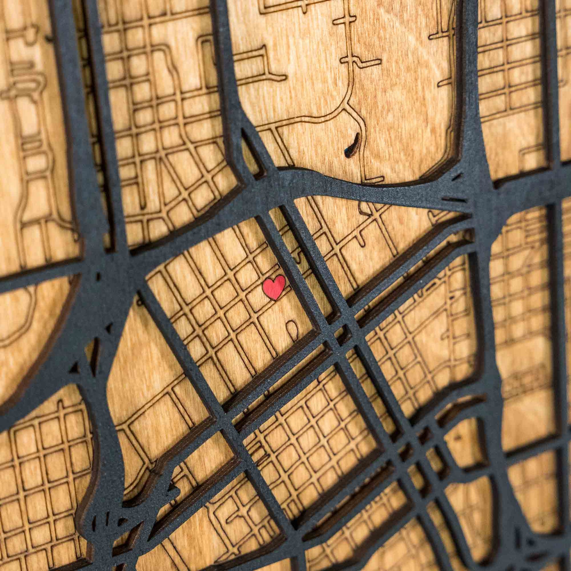 Detail shot of the laser-cut personalization, streets and neighborhoods on the Tulsa, Oklahoma, wooden map