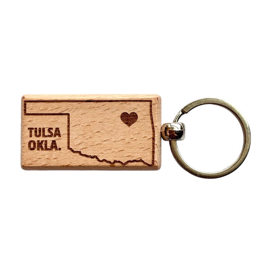 Isolated Tulsa Oklahoma wooden keychain on white background with engraved state map and heart detail, lightweight wood keychain with metal ring