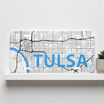 Tulsa Road Map vanity license plate displayed on a white shelf, detailed Oklahoma city map souvenir by The Curious Bison.