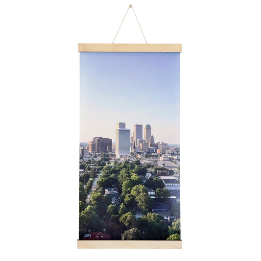 Tulsa skyline canvas wall hanging featuring original aerial photography of downtown Tulsa Oklahoma above tree-lined neighborhoods with natural wood hanging rails
