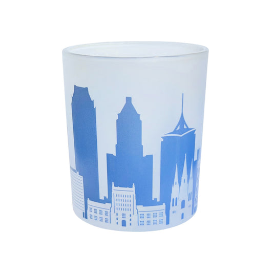 Front product view of frosted 8 oz Tulsa skyline whiskey glass with blue wraparound cityscape featuring Tulsa Oklahoma architecture, a functional Tulsa souvenir and gift