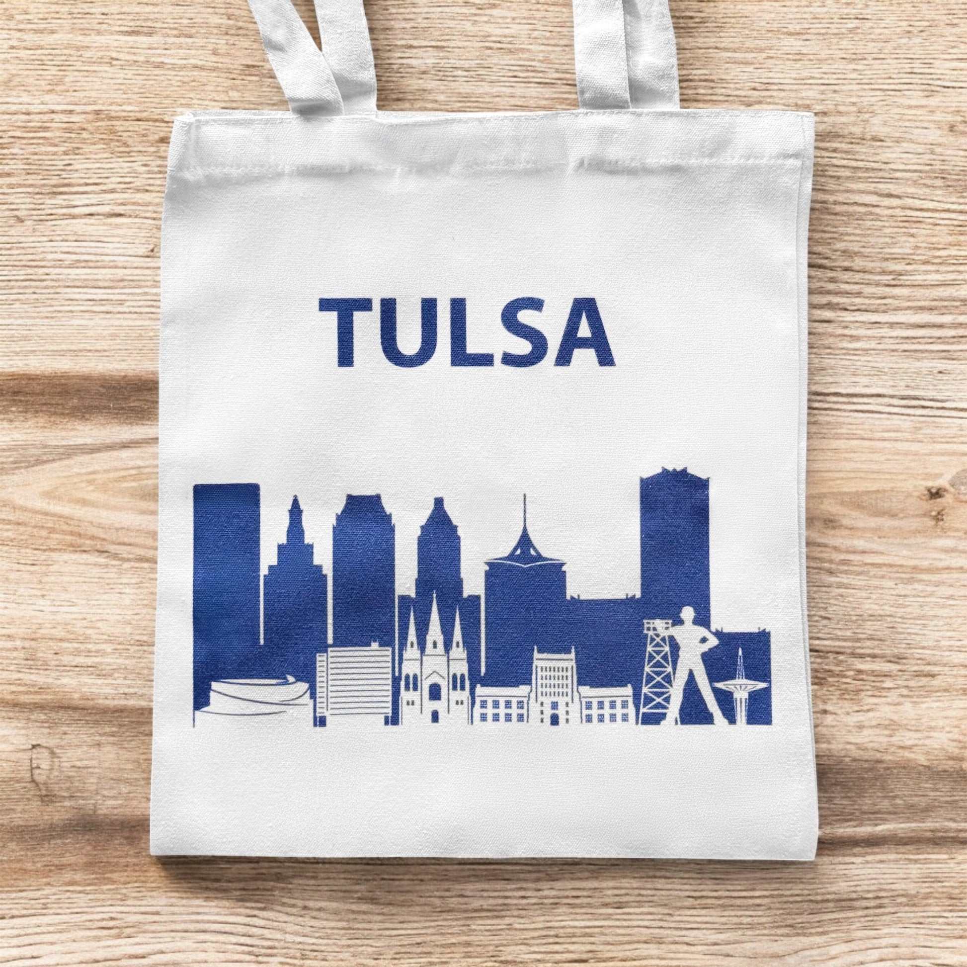 Small Tulsa skyline tote bag shown flat with navy Tulsa skyline illustration
