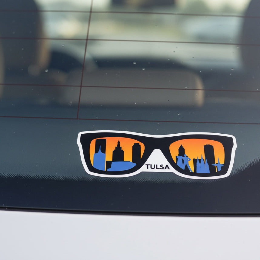 Tulsa skyline sunglasses vinyl sticker displayed on car rear window, sunset city silhouette Oklahoma decal