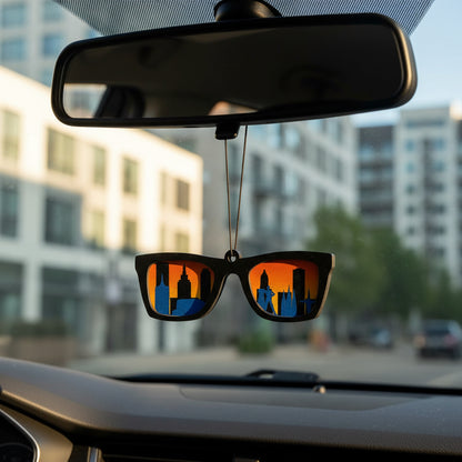 Wooden Tulsa skyline sunglasses car ornament hanging from rearview mirror, laser cut city silhouette with downtown Tulsa buildings inside sunglasses shape, sunset auto accessory gift for Tulsa locals, Oklahoma travelers, and Route 66 road trip souvenir collectors